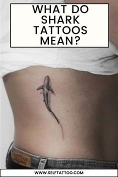 a woman's stomach with the words what do shark tattoos mean? on it