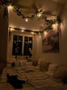 a dog laying on top of a bed under lights