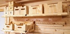 wooden boxes are stacked on shelves in a room