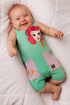 Keep cool on sunny days with our sleeveless Princess Ariel romper. Forget the hassle of snaps, our innovative romper is easy on, easy off. Our neckline dynamically stretches to shimmy up your little one’s torso. Your kiddo will be comfy and enjoy playing unrestricted in our soft, stretchy fabric. What to wear to disneyland for kids what to wear to disney world for kids girls princess outfits disney kids clothes Little girl Ariel clothes The little mermaid outfits for babies baby girl clothes Princess Outfits Disney, Baby Mermaid Outfit, Mermaid Outfits, Little Mermaid Outfit