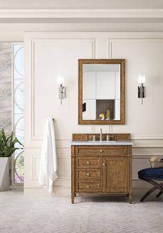 a bathroom with a sink, mirror and chair