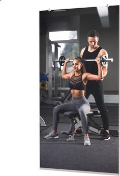 a man and woman doing squats with dumbbells in a gym setting, one holding a barbell