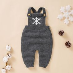 These adorable knit jumpsuits area great combination of warm, cozy and cute all packed in one. Comes in 3 colors. Lay flat to dry Imported CLEARANCE ITEM - LAST FEW IN STOCK! Winter Cotton Onesie, Cozy Solid Onesie For Winter, Cozy Solid Color Onesie For Winter, Gray Cotton Onesie For Winter, Winter Cotton Jumpsuits And Rompers For Loungewear, Winter Knitted Long Sleeve Onesie, Gray Long Sleeve Jumpsuits And Rompers For Winter, Casual White Jumpsuits And Rompers For Winter, Cotton Long Sleeve Overalls For Winter