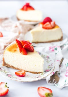 two slices of cheesecake with strawberries on top