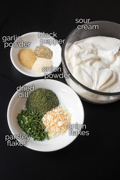 three bowls with different types of food in them on a black surface, including yogurt, sour cream and parsley