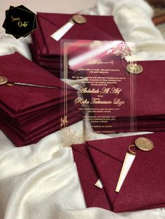 a pile of red envelopes sitting on top of a bed