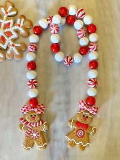 two gingerbreads and some candy on a table