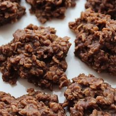 chocolate cookies are arranged on a white plate