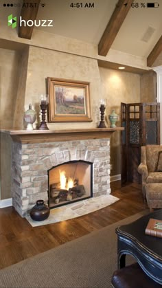 a living room filled with furniture and a fire place in the middle of a room