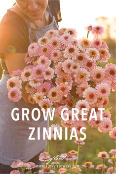 a woman holding flowers with the words grow great zinnas