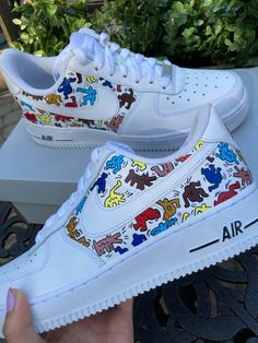 Customized AF1's with hand-painted Keith Haring inspired design! This design is painted on brand new white women's Nike Air Force 1 '07's (come with box). These shoes are made to order, so I do not accept returns/refunds. Shoes are painted with Angelus leather paint and then sealed with a waterproof matte acrylic finisher (also Angelus brand). Feel free to message me with any questions you might have! Keith Haring Shoes, Sporty White Custom Sneakers With Graffiti Print, White Custom Sneakers With Graffiti Print, White Low-top Graffiti Sneakers, White Low-top Sneakers With Graffiti Print, Casual White Custom Sneakers With Artwork, Custom White Sneakers With Waterproof Paint, White High-top Custom Sneakers With Graffiti Print, Artistic White Custom Sneakers For Streetwear