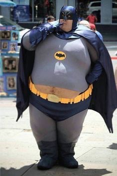 a man dressed as batman on the street