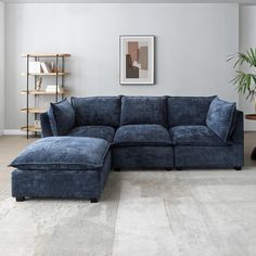 a living room with a large blue couch