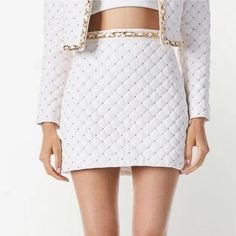 Alice And Olivia Riley Quilted Vegan Leather Mini Skirt Luxury Lined Mini Skirt, Luxury Fitted Mini Skirt, Luxury Party Mini Skirt, Luxury Spring Mini Skirt, Luxury Mini Skirt For Summer, Luxury White Skirt For Spring, Luxury Lined Skirt For Spring, Luxury White Evening Skirt, Luxury Mini Skirt