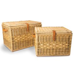 two wicker baskets with leather handles on the sides, one is empty and the other has