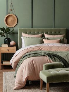 a bedroom with green walls and pink bedding