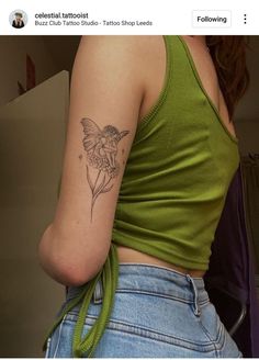 a woman with a small tattoo on her left arm and the back of her shoulder