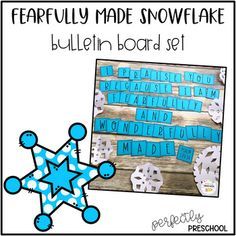 a snowflake bulletin board set with blue and white paper