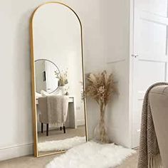 a large mirror sitting on top of a white rug