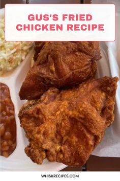 fried chicken on a white plate with sauce and coleslaw in the background text reads gus's fried chicken recipe