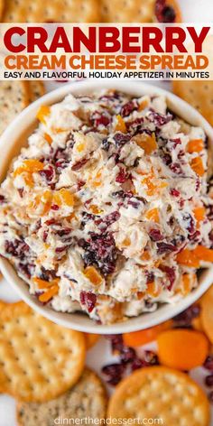 cranberry cream cheese spread in a bowl surrounded by crackers and oranges