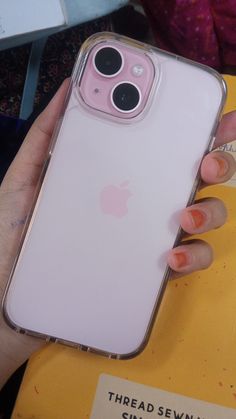 a person holding an iphone case in their hand