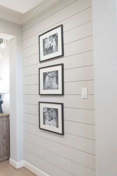 three black and white pictures hang on the wall next to a dresser in a room