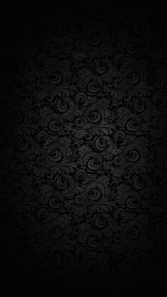 a black wallpaper with swirls on it