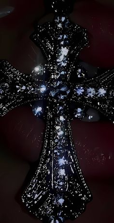 the cross is made up of stars and sparkles