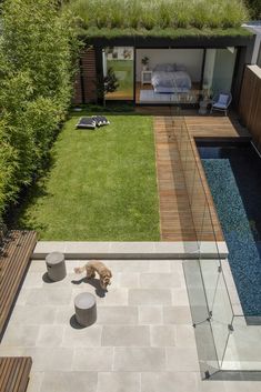 an aerial view of a house with a dog laying in the yard