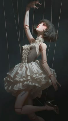 a woman in a white dress is suspended by strings