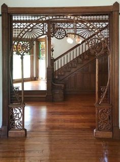 an ornate wooden entry way in a house