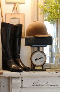 a hat and boots are sitting on top of a shelf next to a clock with a thermometer