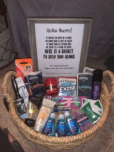 a basket filled with lots of different items next to a sign that says hello there