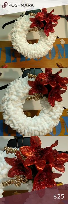 three christmas wreaths with red flowers on them