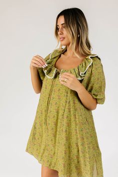 the answer to your puff sleeve prayers, this vintage-inspired green floral mini dress will take you from day to night, season after season. it features a dainty ruffle neckline, dramatic puff sleeves, + a muted multi-color floral pattern. with its relaxed silhouette + flowy shape, it’s the perfect puff sleeve mini dress to pair with your favorite heels, boots, sandals, or sneaks. green base + cream stitch // scoop neckline, front tie, dramatic puff sleeves, pockets, lined model is 5'8" + wearing Mini Dres, Puff Sleeve Mini Dress, Puff Sleeve Dress, Puffed Sleeves Dress, Heels Boots, Floral Mini Dress, Mini Dress With Sleeves, Lining Fabric, Scoop Neckline