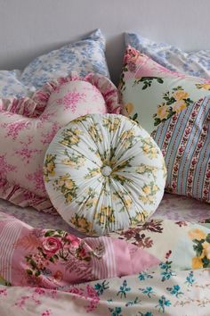 the pillows are all different colors and patterns