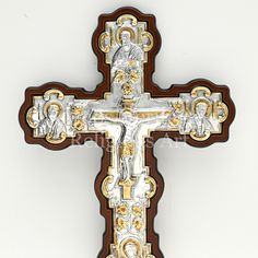 the cross is decorated with gold and silver