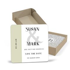 the save the date card is in a cardboard box