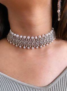 Luxury Tilla Choker For Gift, Luxury White Kundan Necklace For Wedding, Luxury Pearl Chain Choker, Luxury Pearl Chain Choker Jewelry, Hand Set Choker Necklace For Receptions, Elegant Hand Set Bridal Choker Necklace, Elegant Hand Set Choker Bridal Necklace, Elegant Bridal Hand Set Choker Necklace, Elegant Hand-set Choker Bridal Necklace