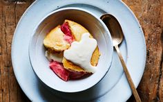 a white plate topped with a dessert covered in icing