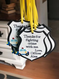 "This listing is for a set of police officer thank you party favor tags. Size: 2.5\" tall, 2\" wide. The police car is printed and then cut using a professional cutting machine. The car is 1\" wide. Ribbon: 1/8\" wide Please leave the name in the notes section of your cart before checking out. Coordinating Items https://www.etsy.com/shop/declanandsmith?ref=seller-platform-mcnav&section_id=22450786 --->I accept a limited number of orders per week. All orders will ship 10 days prior to the Police Officer Birthday, Police Birthday Party