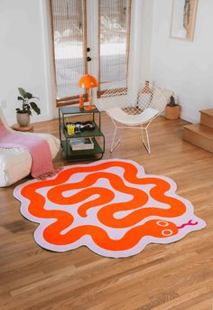 an orange and white rug on the floor in a living room