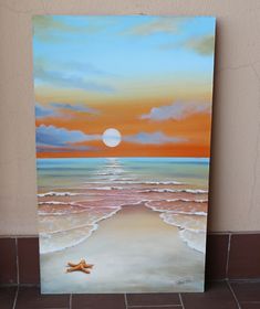 a painting of a starfish on the beach at sunset