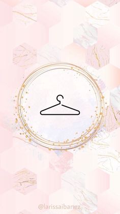 a pink and gold background with a hanger on it's side in the middle