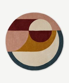 a circular rug with an abstract design on it