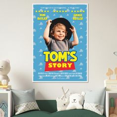 a child's poster hangs on the wall above a bed