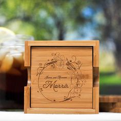 a wooden box that has some drinks in it on a table next to other items