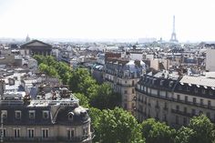 an aerial view of paris with the eiffel tower in the distance