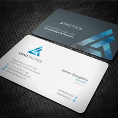 two business cards sitting on top of each other